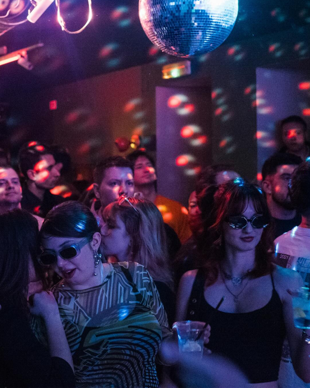 Crowd dancing under a disco ball at Kotur, Skopje