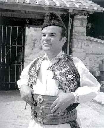 Black-and-white portrait of a man wearing traditional Macedonian dress