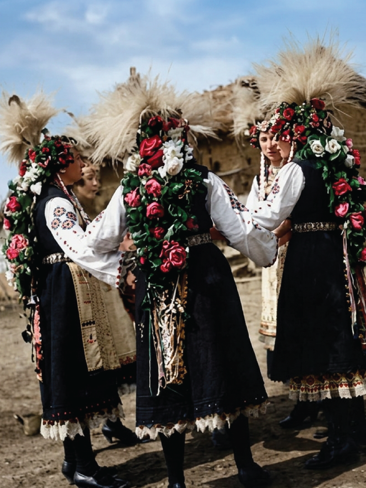 Women in traditional Macedonian dress gathered outdoors