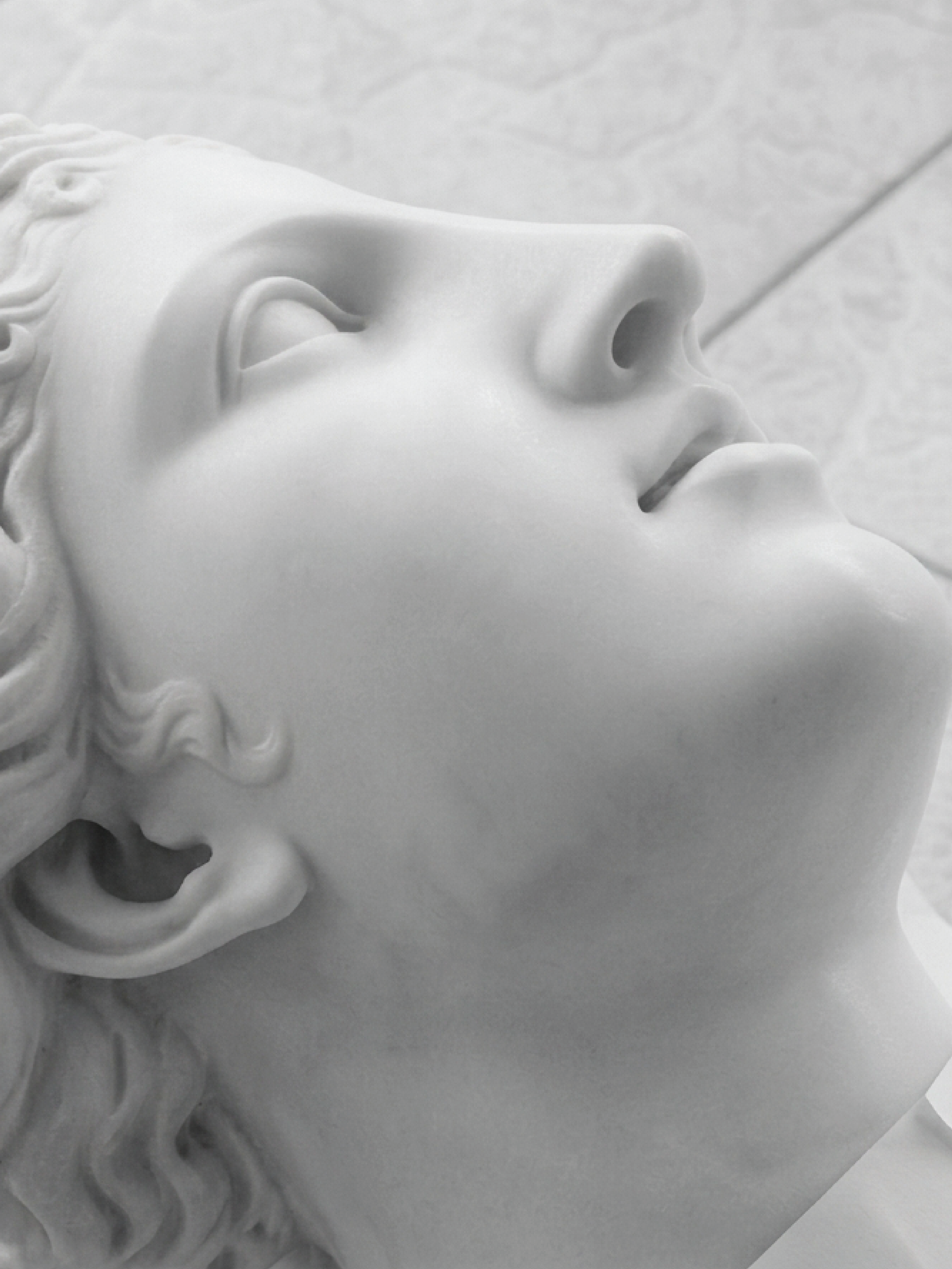Close detail of a marble Venus face.